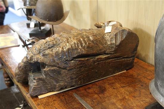 A 16th century Flemish oak deep relief figure of the recumbent lamb W.29in.
